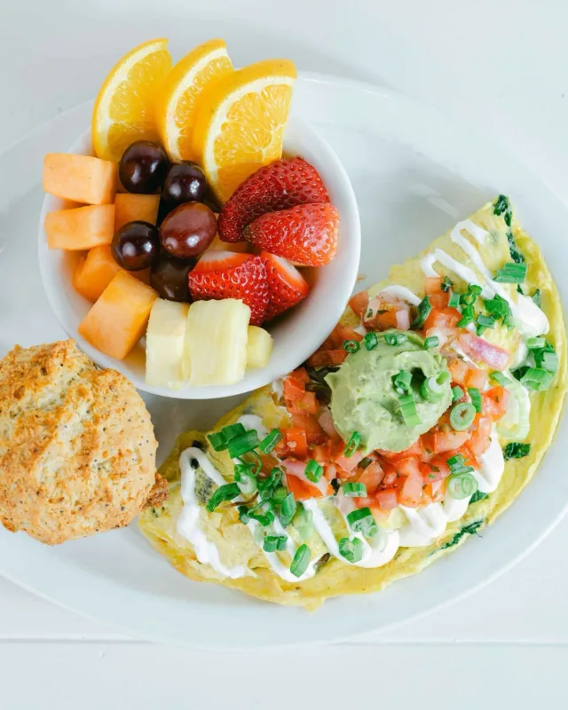 Start your morning on a light wave with our Surfer Girl Omelet! ☀️

A fresh and flavorful combo of spinach, wild mushrooms, tomato, cream cheese, and onion topped with avocado, pico de gallo, and sour cream. Served with skillet potatoes and an everything muffin. Order now at wildeggs.com 📲